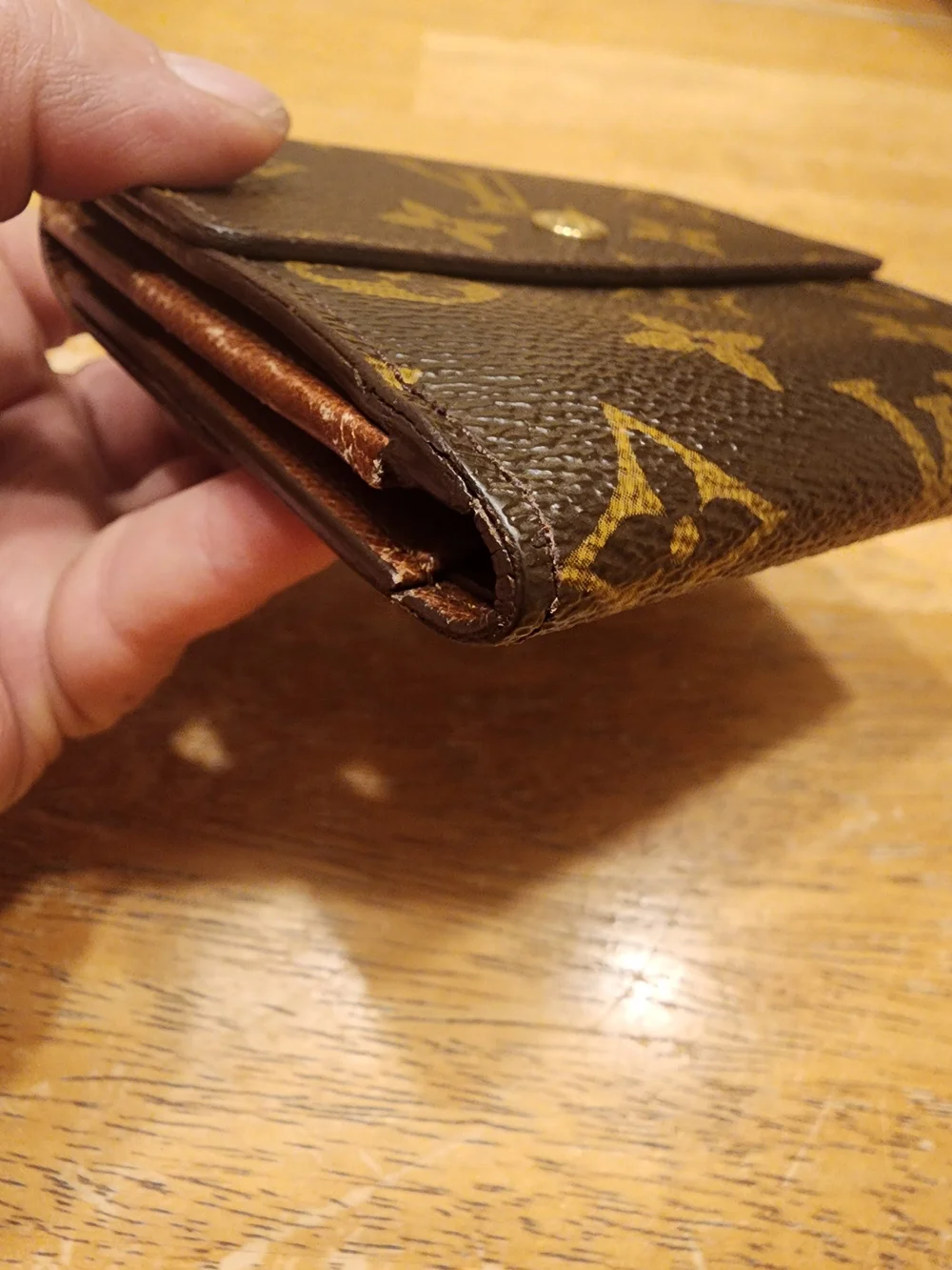 vintage Louis Vuitton Monogram Elise Wallet crafted in the classic brown LV